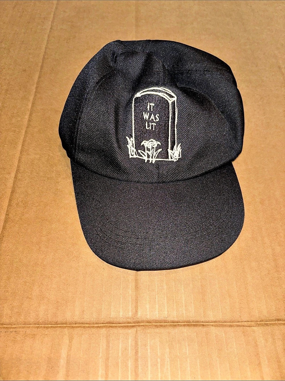 OMIGHTY Embroidered Graphic Hat in Black